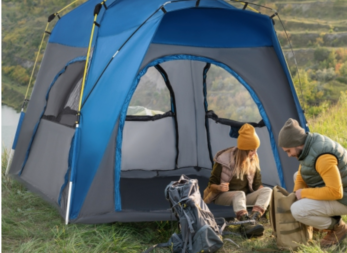 Man and woman sitting outside Outsunny instant automatic camping tent. 