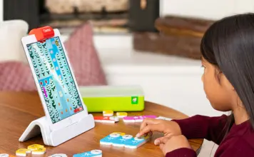 Girl learning to code with STEM toy.