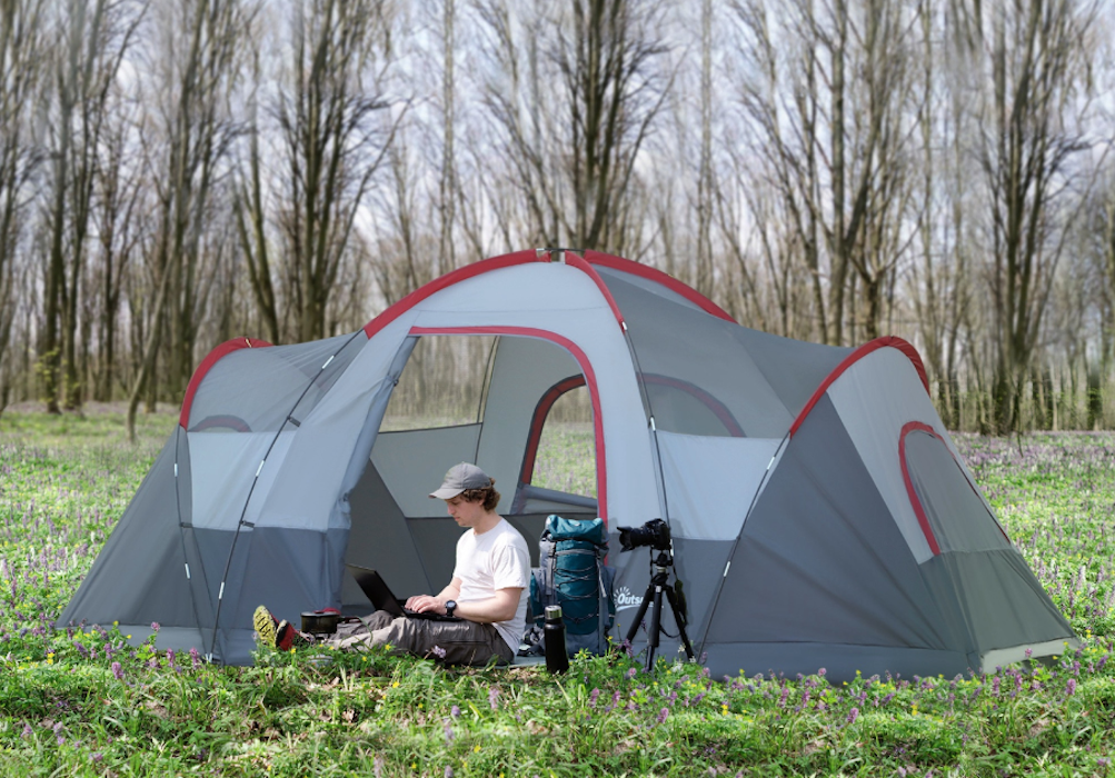 Man sitting outside an outsunny 5-6 person outdoor camping tent. 