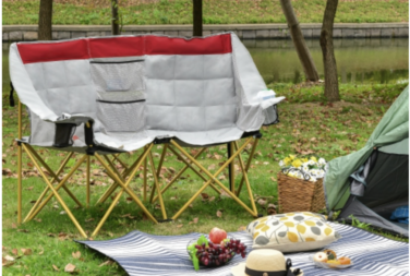 Outsunny double seat camping chair with picnic spread. 