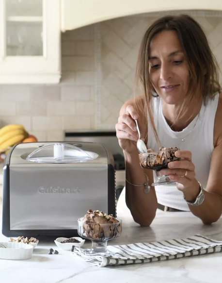 Woman eating ice cream from a compressor ice cream maker.