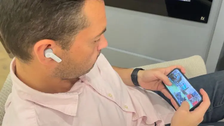 Matthew Rondina playing Call of Duty Mobile on an iPhone using the ROG Centra wireless earbuds.