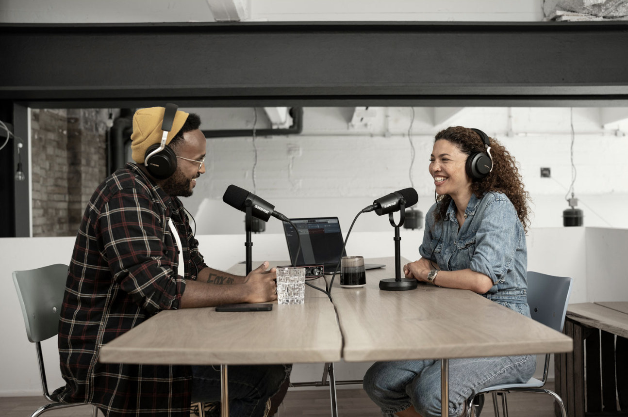 Two people recording a podcast.