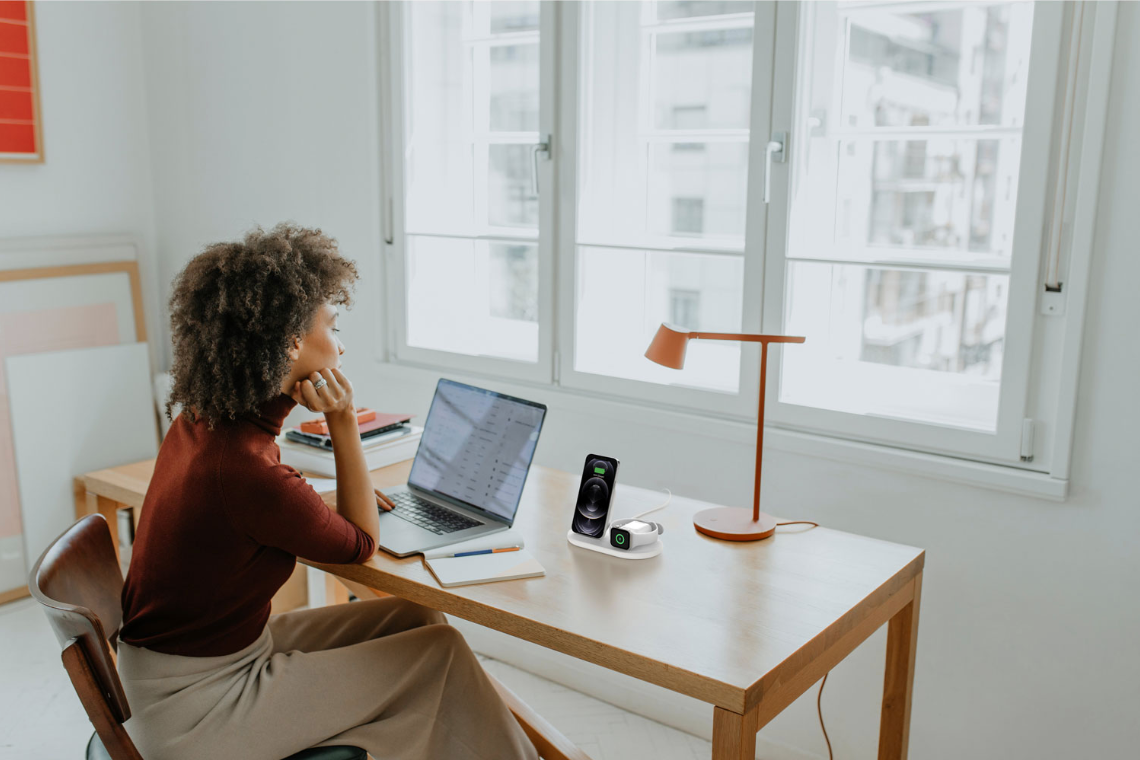 Woman charging devices with wireless charger