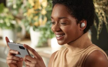 Sony WF-1000XM4 Wireless Earbuds being used to watch videos on a phone