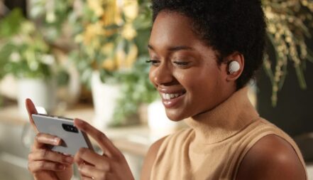 Sony WF-1000XM4 Wireless Earbuds being used to watch videos on a phone