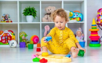 2 year old playing with toy