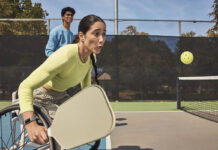 Fitbit Charge 6 on a woman playing pickleball in a wheelchair