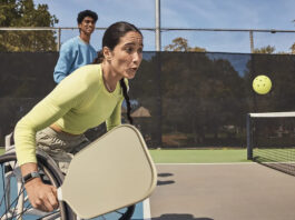 Fitbit Charge 6 on a woman playing pickleball in a wheelchair