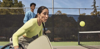 Fitbit Charge 6 on a woman playing pickleball in a wheelchair