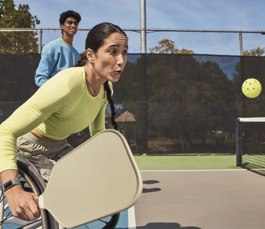 Fitbit Charge 6 on a woman playing pickleball in a wheelchair