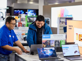 Blue shirt from Best Buy illustrating a Microsoft demo to customer.