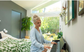 A woman playing music on piano