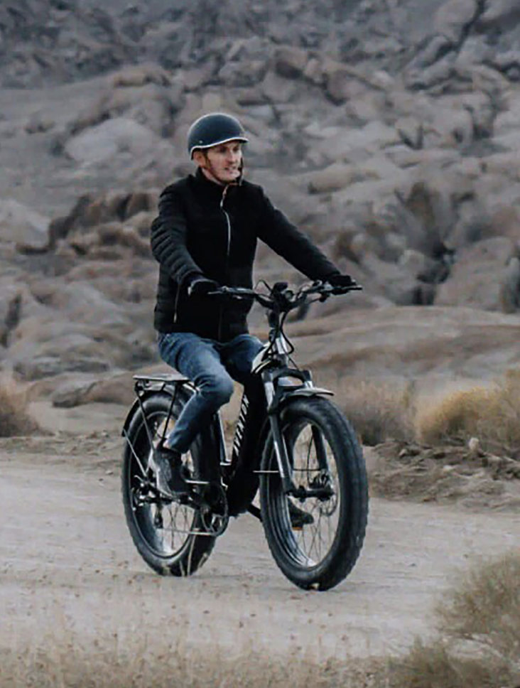 A man riding an Aventon Aventure e-bike