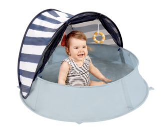 A baby in the Babymoov Aquani travel play tent