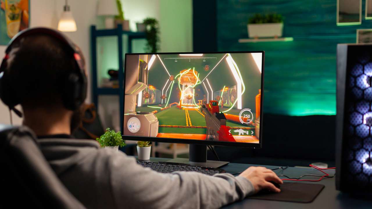 A young boy playing a game on desktop