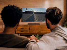 two man watching looking at TV setup with smart TV accessories