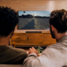 two man watching looking at TV setup with smart TV accessories