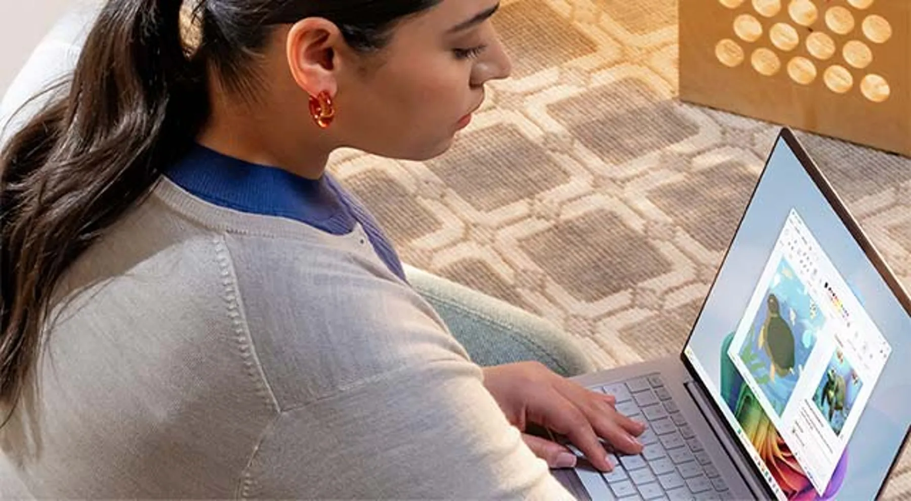 A girl doing a creative projext using Microsoft laptop