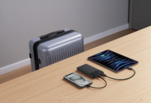 Power bank charging a smartphone and tablet on the go