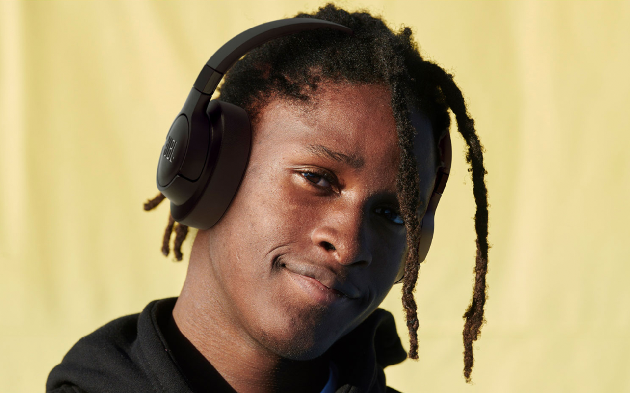 Man wearing sound isolating headphones