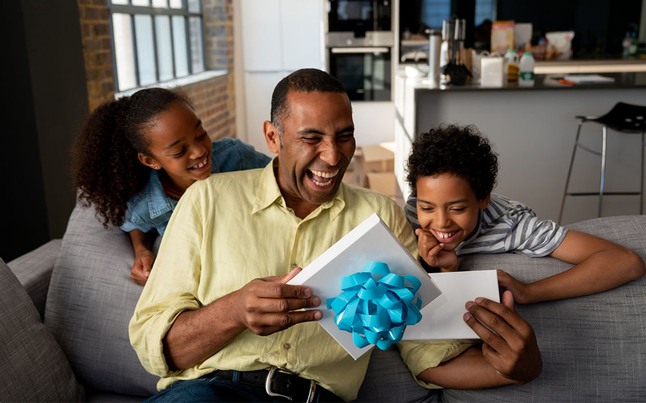 Father and kids with a gift