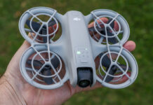 DJI Neo powered on and in palm of hand.