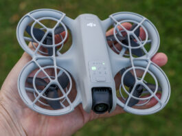 DJI Neo powered on and in palm of hand.