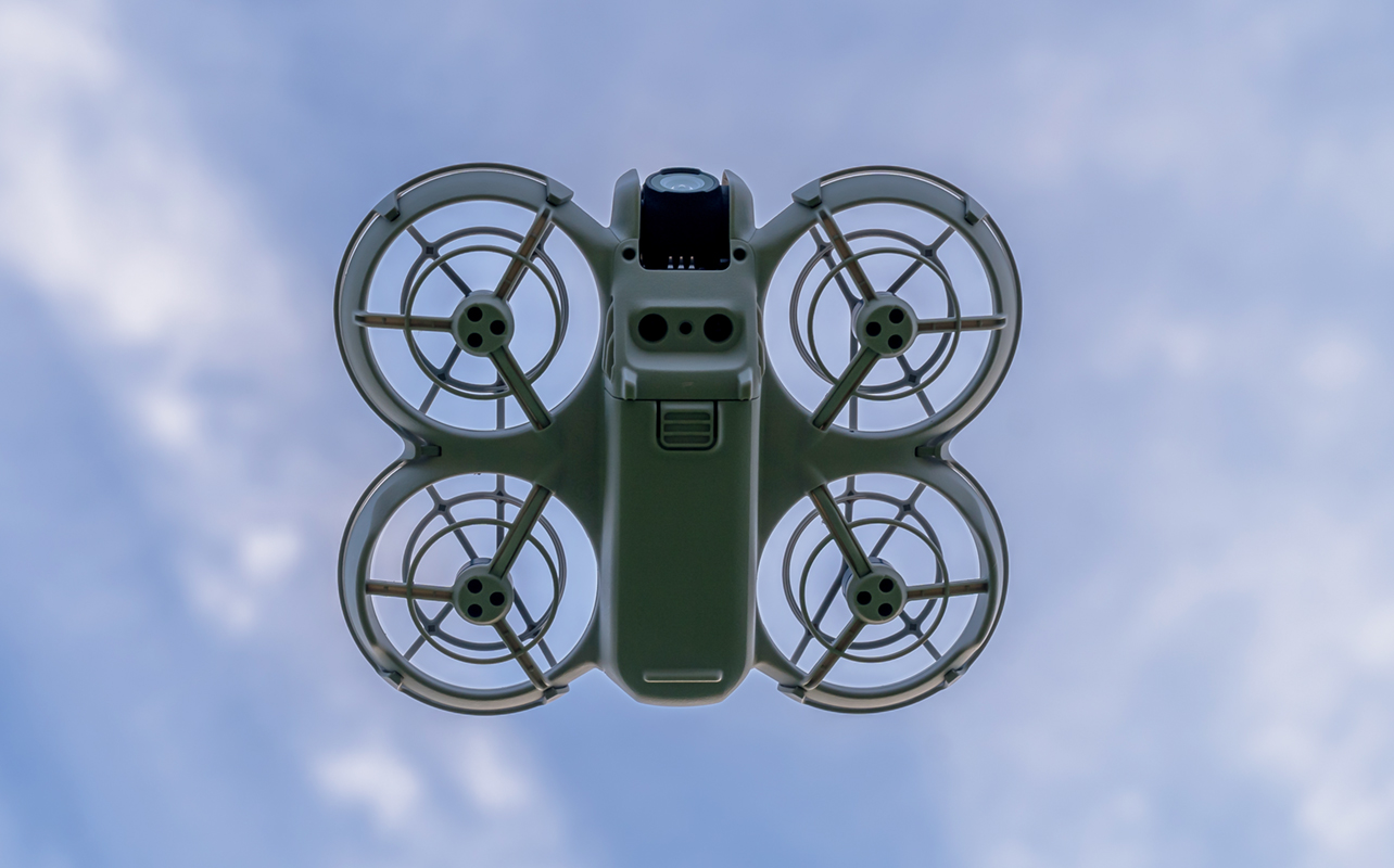 View of underside of DJI Neo while in flight.