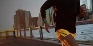 Man running wearing Garmin running smartwatch