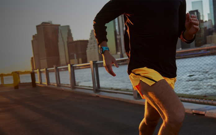 Man running wearing Garmin running smartwatch