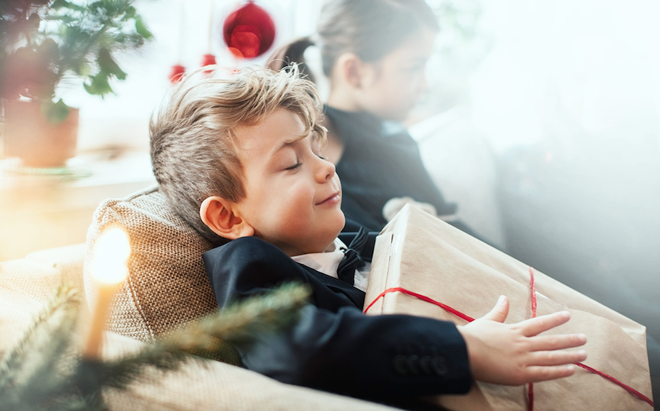 child holds their holiday gift