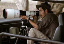 Man shooting with Sony Alpha 1 II outdoors in wildlife.