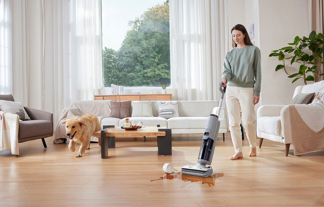 Woman cleaning a spill with the Tineco Go H2O XL.