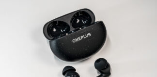 OnePlu sNord Buds 3 Pro earbuds loose in front of open case.