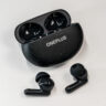 OnePlu sNord Buds 3 Pro earbuds loose in front of open case.