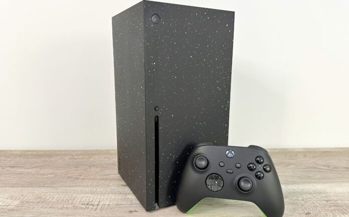 Xbox Series X unboxed on a desk with the console and controller.