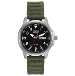 Citizen Garrison eco-drive watch features a day-date indicator, luminous hands, and 37mm screw-back case. The black dial provides a backdrop for simple Arabic numerals, housed in a stainless steel case along with a woven green strap with patterned stitching and a buckle clasp.