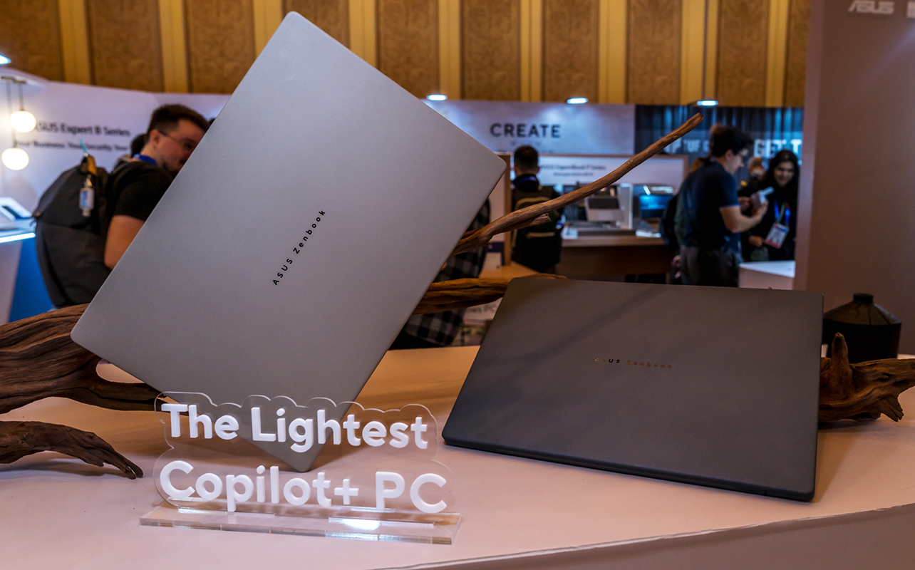 ASUS Zenbook S14 in both colourways with tagline saying "the lightest Copilot+ PC".