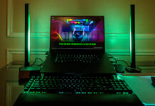 Razer Blade 16 flanked by new Aether Standing Light Bars in green.