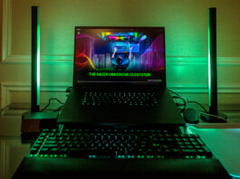 Razer Blade 16 flanked by new Aether Standing Light Bars in green.