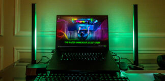 Razer Blade 16 flanked by new Aether Standing Light Bars in green.