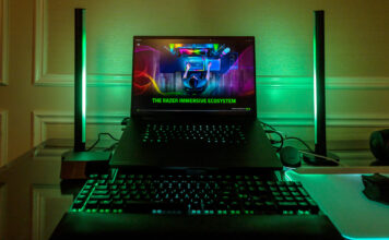 Razer Blade 16 flanked by new Aether Standing Light Bars in green.