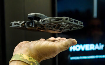 HoverAir X1 taking off from a man's hand at CES 2025.