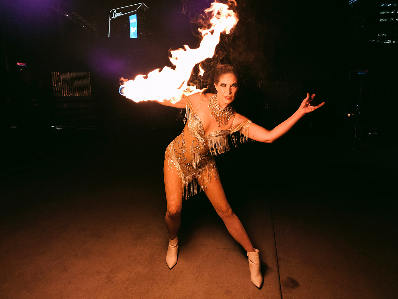 Example photo of a fire performer taken with OnePlus 13.