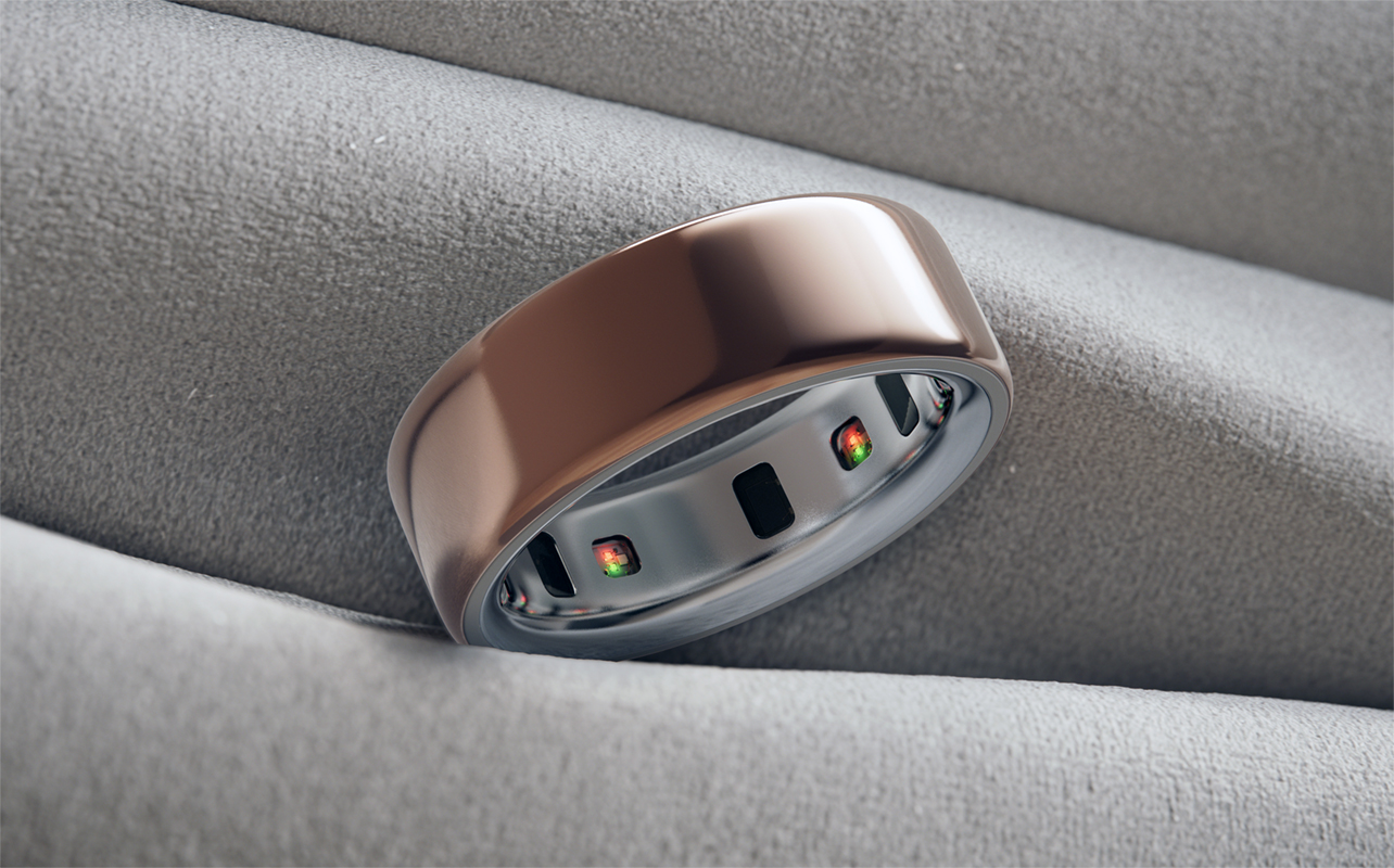 Oura Ring 4 sitting upright with exposed sensors.