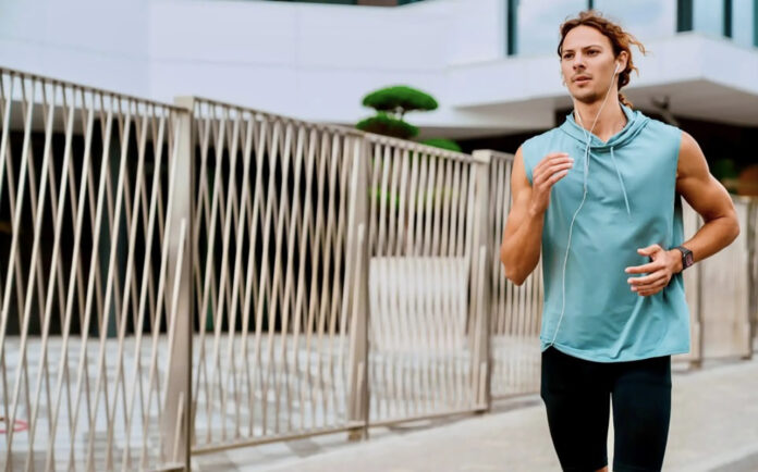 a man running while wearng the Amazfit Active