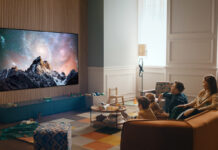 Family watching an OLED TV in living room.