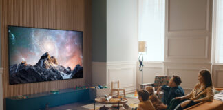 Family watching an OLED TV in living room.