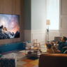 Family watching an OLED TV in living room.